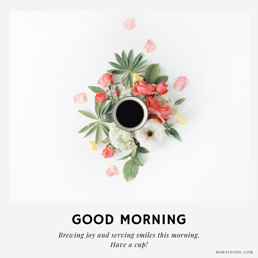 A cup of coffee is surrounded by various colorful flowers and green leaves on a white background. The text below reads, "GOOD MORNING. Brewing joy and serving smiles this morning. Have a cup!" This good morning coffee picture adds an uplifting and cheerful touch.