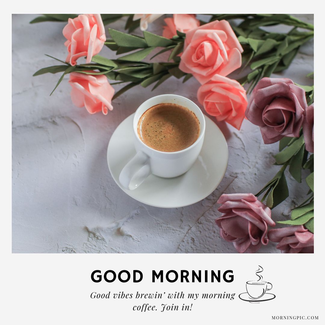A white coffee cup and saucer filled with espresso sit on a textured white surface. Surrounding the cup are pink and mauve roses. The text reads: "GOOD MORNING. Good vibes brewin' with my morning coffee. Join in!"