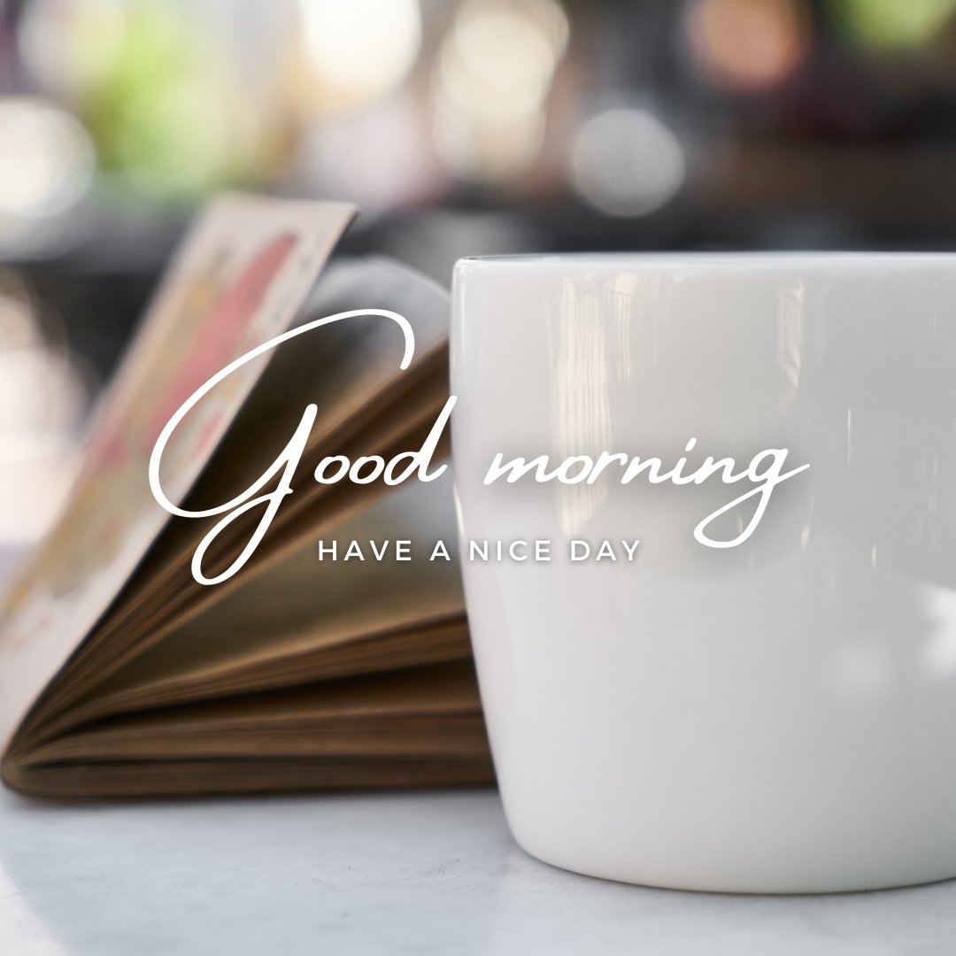 A white coffee cup sits on a table with an open book in the background. The text overlay reads, "Good morning. Have a nice day." This image captures the essence of good morning coffee images.