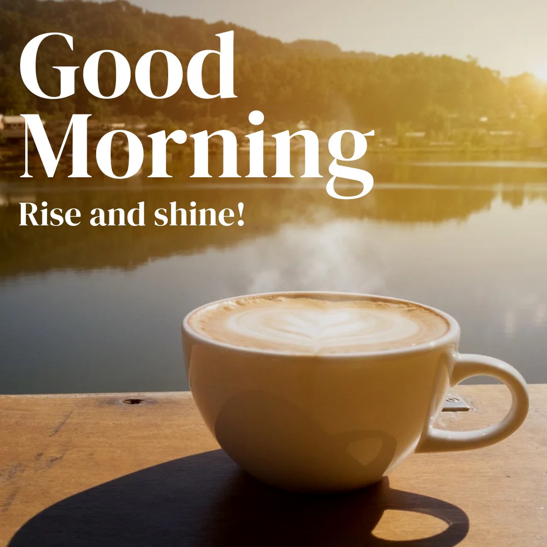 A steaming cup of coffee with latte art sits on a wooden surface against a serene lake backdrop at sunrise. The text "Good Morning" and "Rise and Shine!" is prominently displayed. Perfect for good morning coffee images.