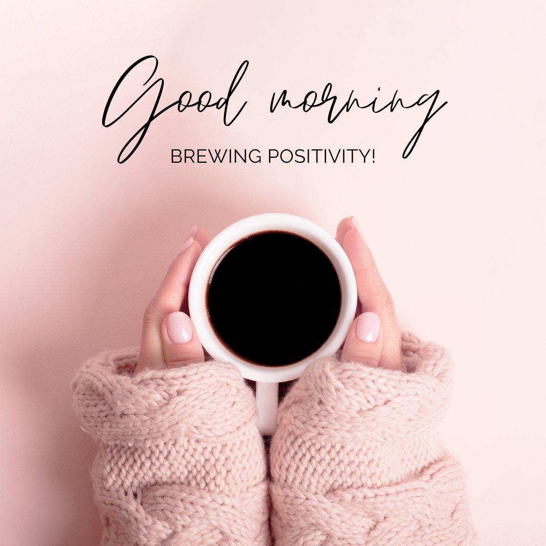 A person in a cozy pink sweater holds a cup of black coffee against a light pink background. The text overlay reads, "Good morning. Brewing positivity!" This image is a warm and inviting example of good morning coffee images.
