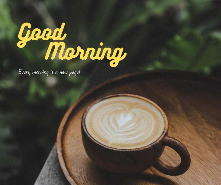 A wooden cup of coffee with latte art sits on a wooden tray with a lush green background. The text overlay reads, "Good Morning. Every morning is a new page!" This image perfectly represents good morning coffee images.